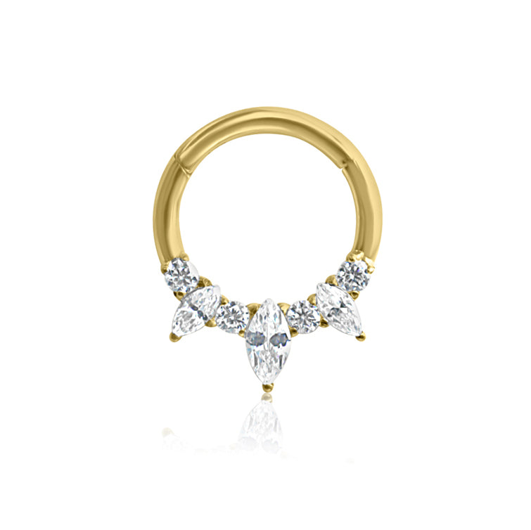 The FEYA Crystal Daith Hoop by Crystal Heaven London is a 16g hinged septum clicker made from certified ASTM F136 titanium. It's hypoallergenic, waterproof, and nickel-free with an intricate design featuring clear marquise and round-cut stones clustered at the bottom.