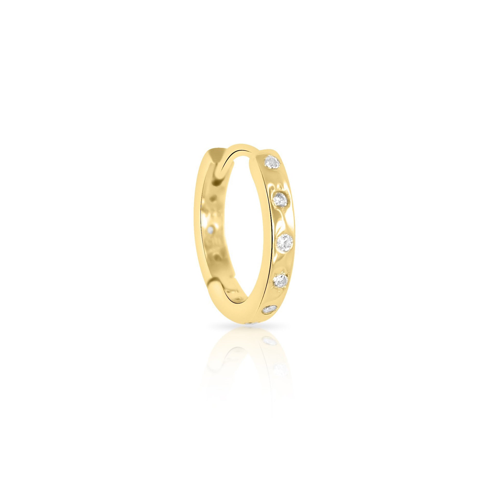The HAVANA Slim Starburst Huggie Hoop by Crystal Heaven London features a gold ring with a row of small diamonds on the band, reminiscent of starburst detailing, displayed on a white background.