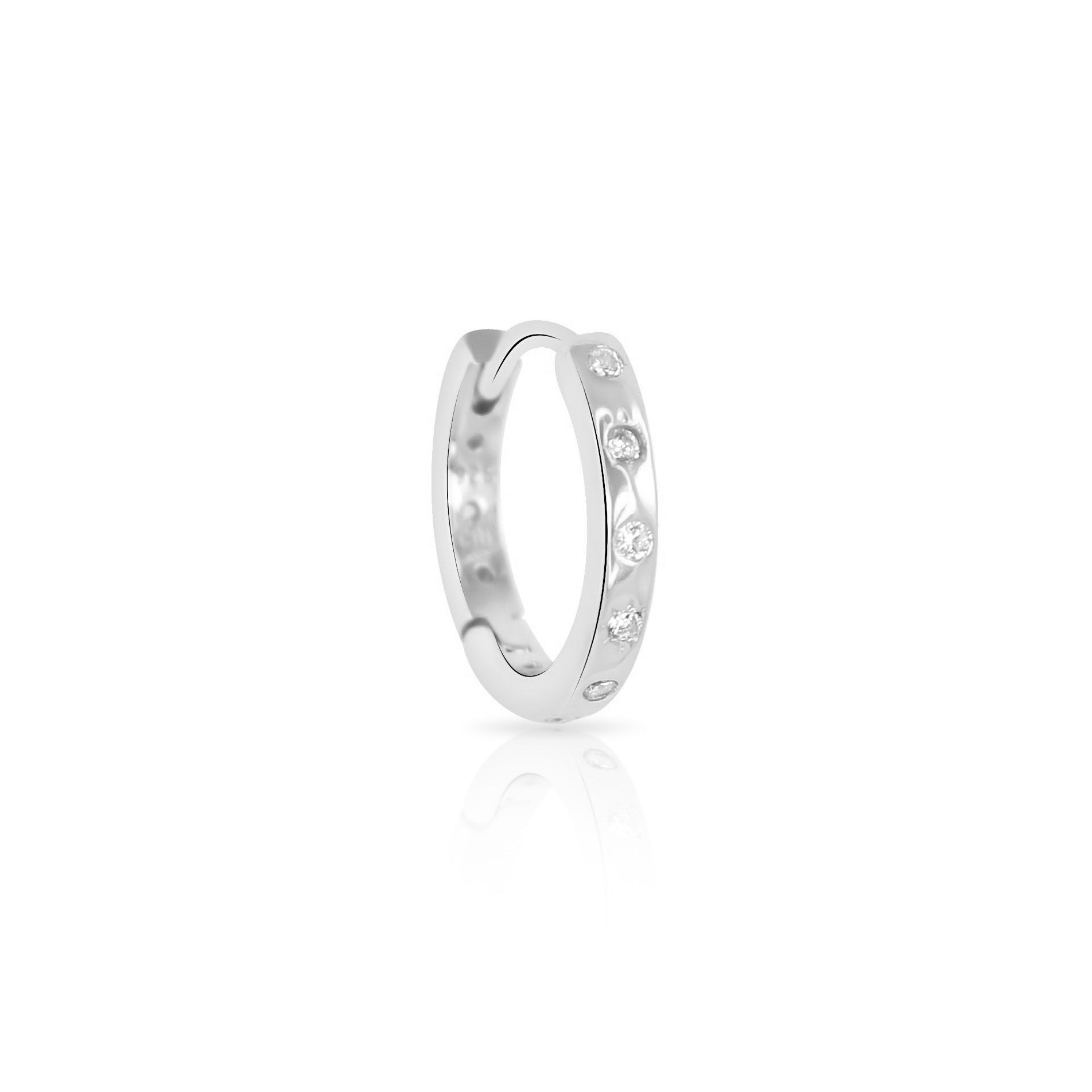 The Crystal Heaven London HAVANA Slim Starburst Huggie Hoop, a silver earring featuring round gemstones and elegant starburst details, is set against a plain white background.