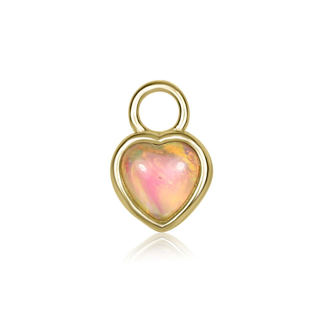 Heart-shaped opal pendant with gold frame on a white background