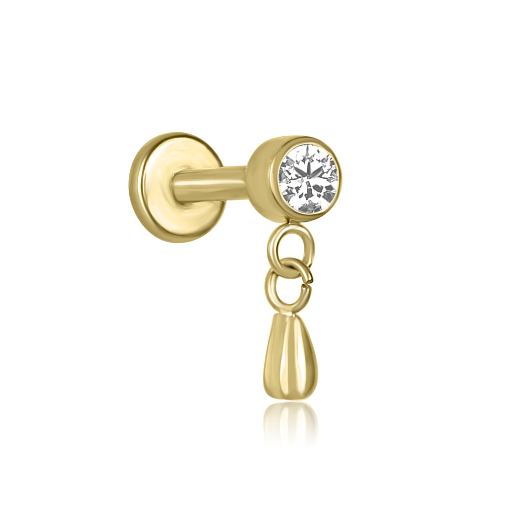Gold earring with a clear gemstone on a white background