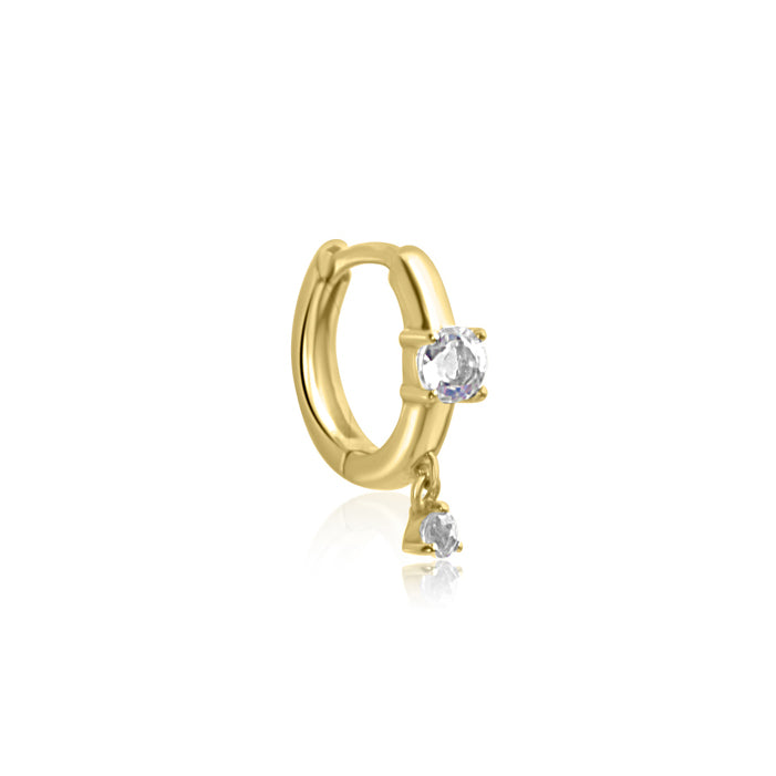 The CHLUXE Moonstone Droplet Huggie Hoop by Crystal Heaven London features a 14K yellow gold huggie earring with a clear gemstone on the hoop and a dangling moonstone below.