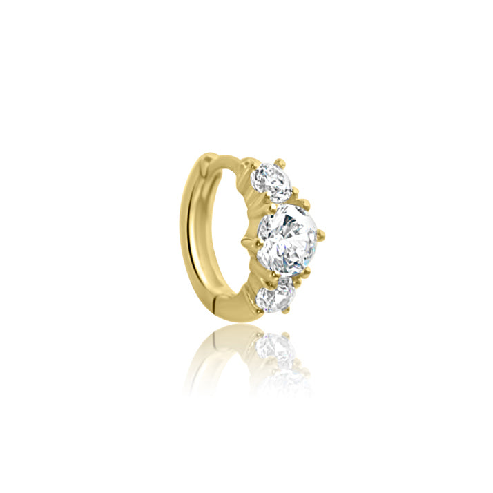 The CHLUXE Stacked Crystal Huggie Hoop by Crystal Heaven London features a stunning 14K solid yellow gold design with three round, clear gemstones in a row.