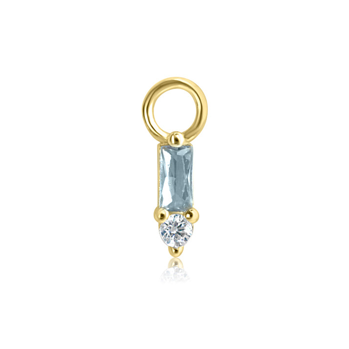From Crystal Heaven London's Nerida Collection, the ESSENCE Stacked Baguette Crystal Charm showcases a gold design with a vertical rectangular aquamarine crystal and a small round clear gemstone below.