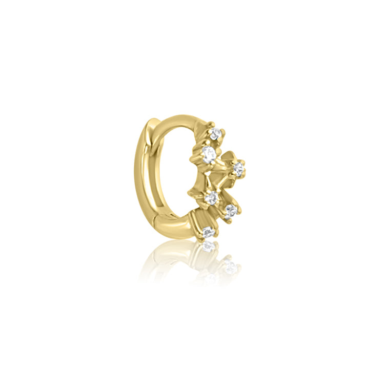 The CHLUXE Constellation Huggie Hoop by Crystal Heaven London is a 14K yellow gold earring with a star-shaped design and white gemstones, perfect for those who appreciate timeless elegance.
