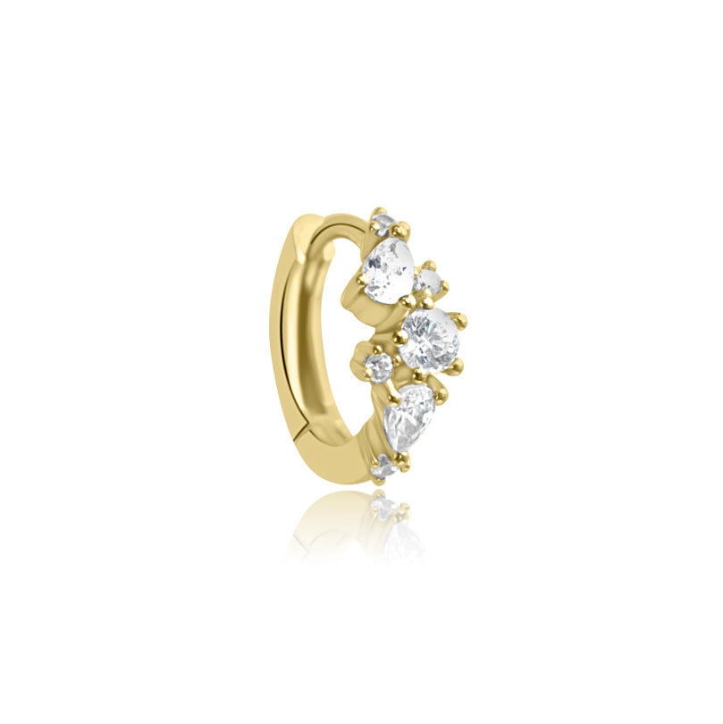 The MARGOT Scattered Gem Huggie Hoops by Crystal Heaven London feature teardrop-shaped clear Cubic Zirconia gemstones, delivering a touch of elegance akin to sterling silver earrings.