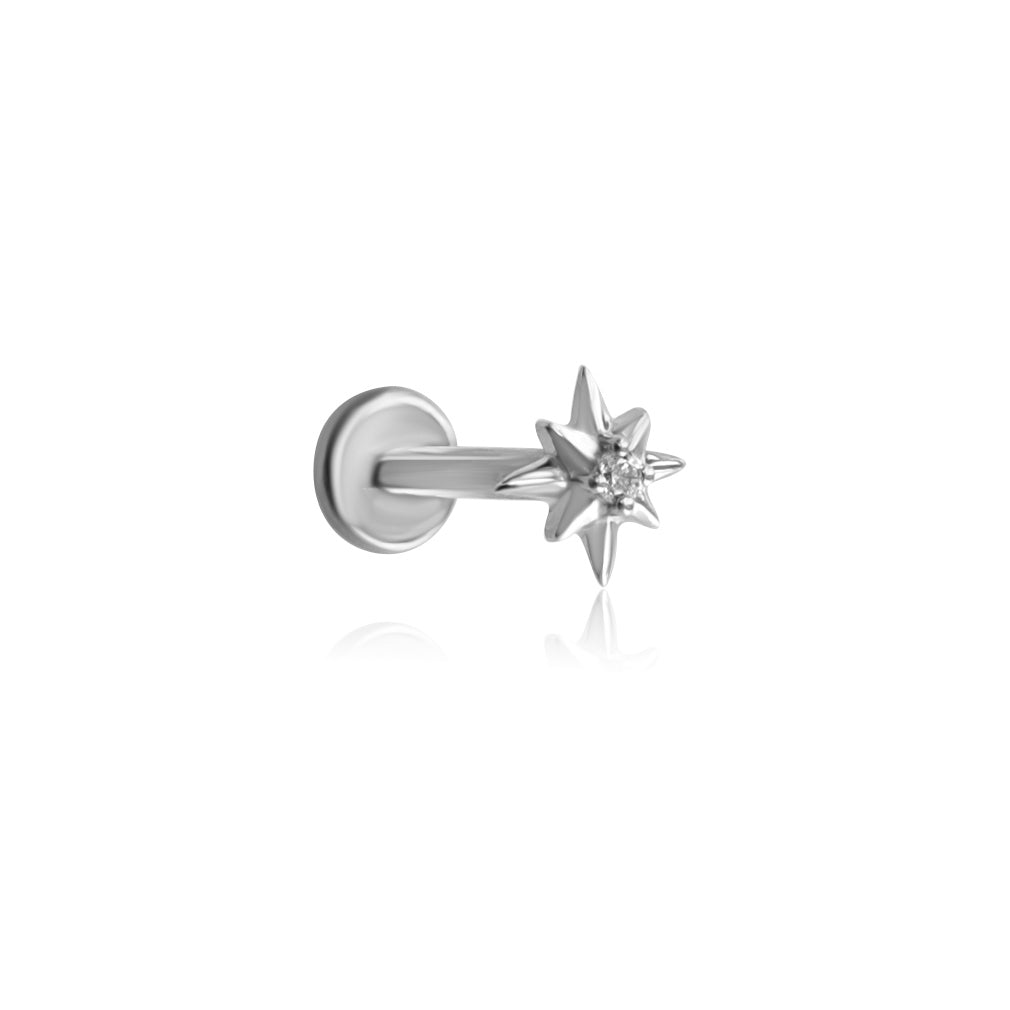 The VENUS Threadless Cartilage Stud by Crystal Heaven London features a silver star-shaped design with a central clear gemstone, reminiscent of the North Star, set against a plain white background.