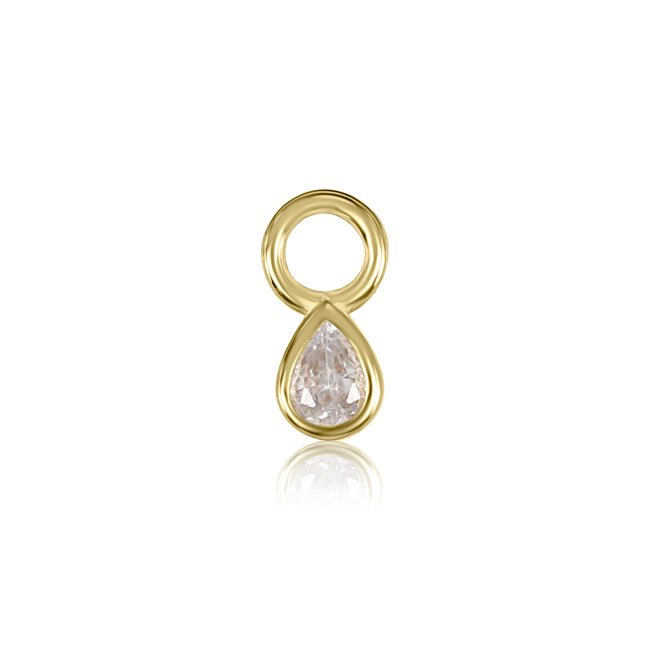 The Teardrop Bezel Charm by Crystal Heaven London elegantly cradles a dazzling cubic zirconia gemstone in its center.